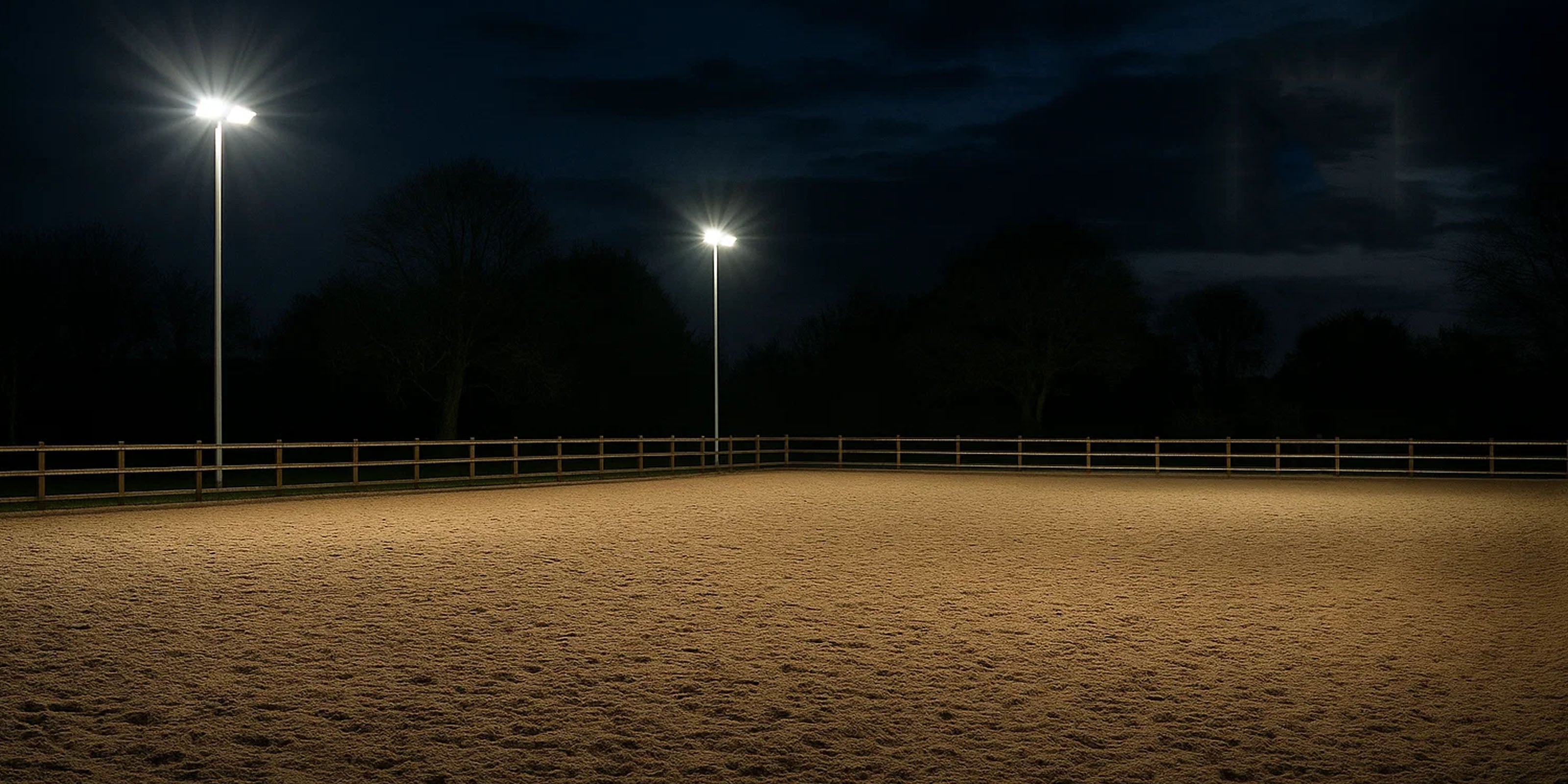 Outdoor horse menage with professional LED lighting after dark