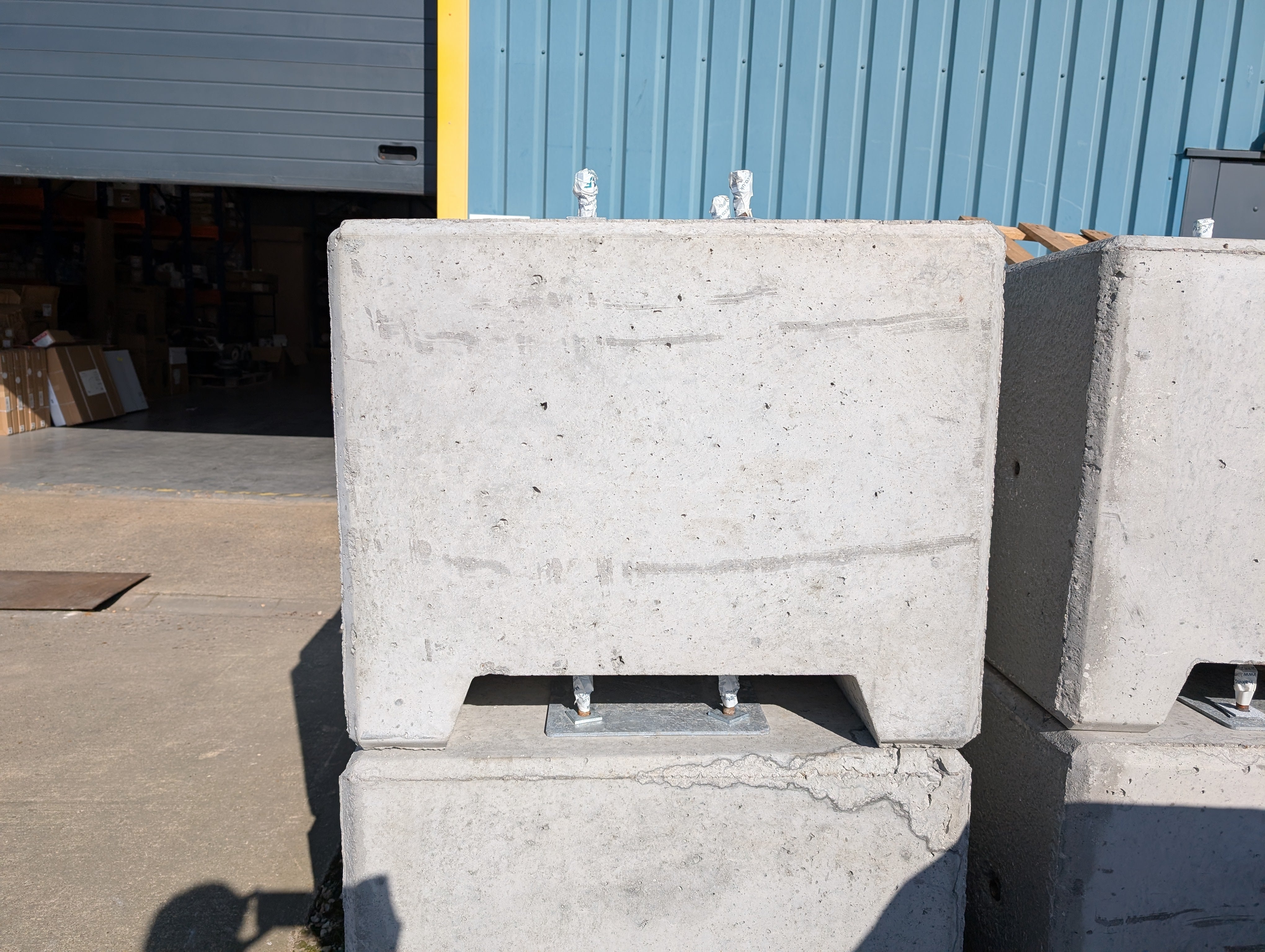 Precast 500kg concrete block for fast, secure installation—suitable for lighting columns and marquees. Forklift slots and lifting anchor point for positioning.