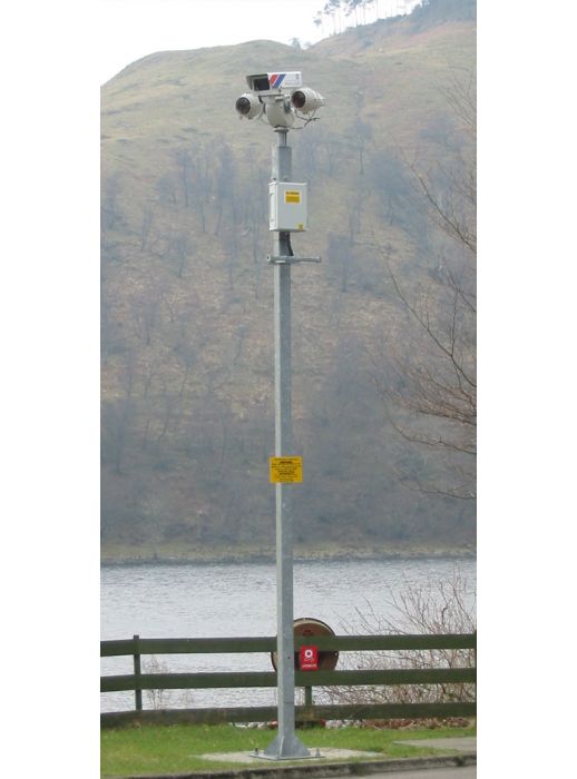 Galvanised steel CCTV column with mounted dual surveillance cameras and control box, ideal for perimeter and remote site security monitoring.
